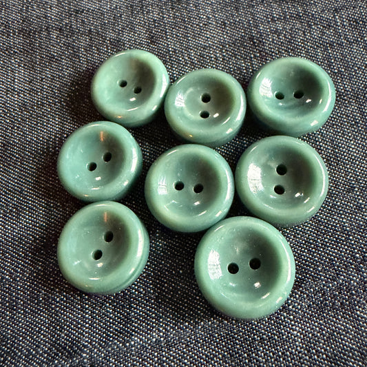 Natural teal casein concave button, handmade in Argentina.