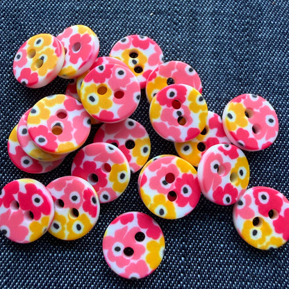 Whimsical patterned plastic shirt buttons in six prints on denim