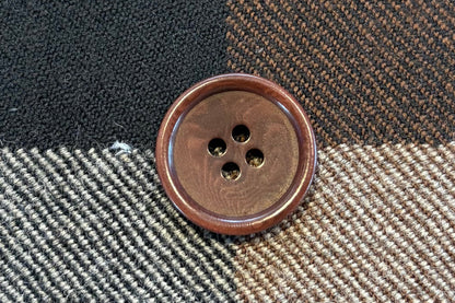 Plaid fabric with a button in the center