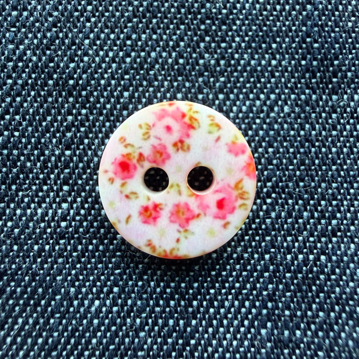 Whimsical patterned plastic shirt buttons in six prints on denim