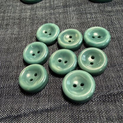 Natural teal casein concave buttons in 17 mm and 27 mm.