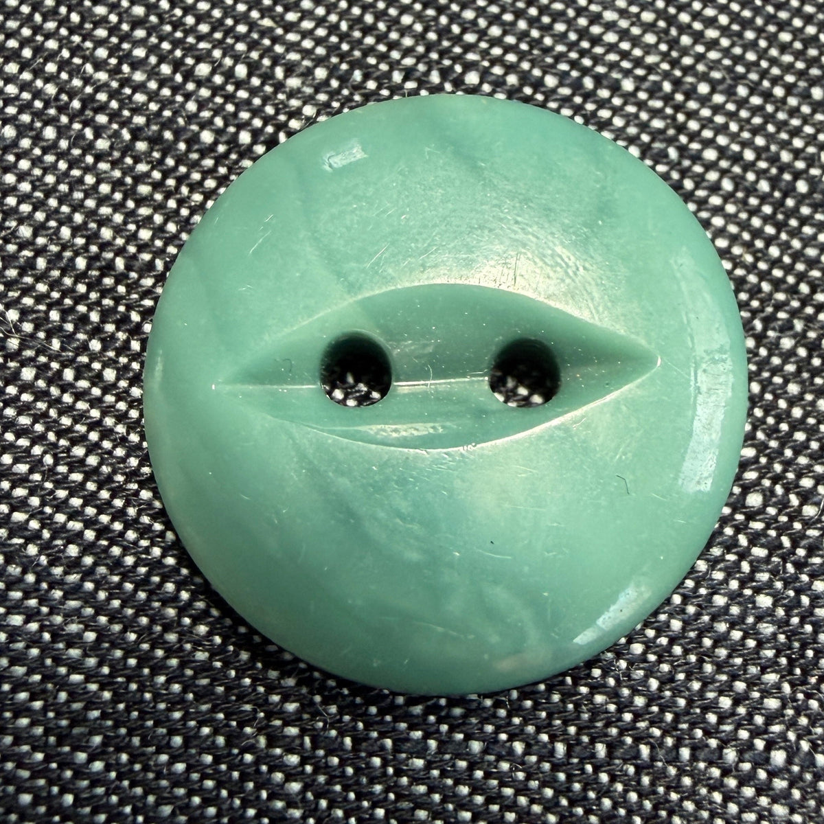 Natural teal casein fisheye button, 20 mm, handmade in Argentina.
