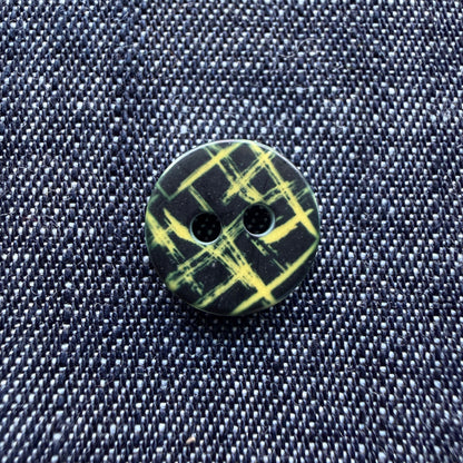 Whimsical patterned plastic shirt buttons in six prints on denim
