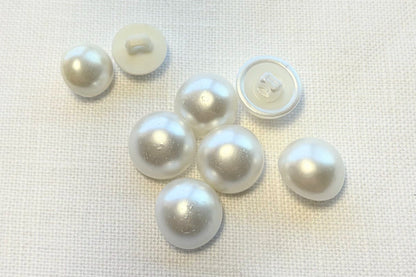 Set of white pearl buttons